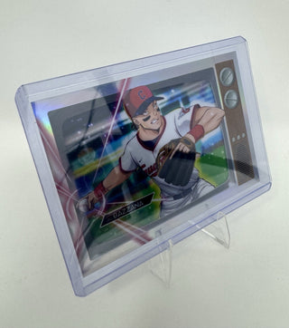 A collectible baseball trading card featuring an anime-style illustration of a player on a holographic insert, housed in a clear protective plastic case and displayed on a small clear stand against a plain light background.